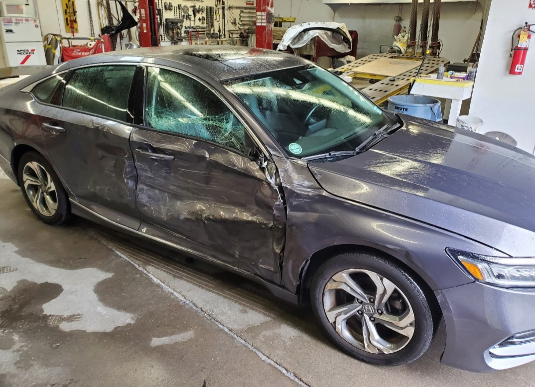 Honda with collision damage before repair