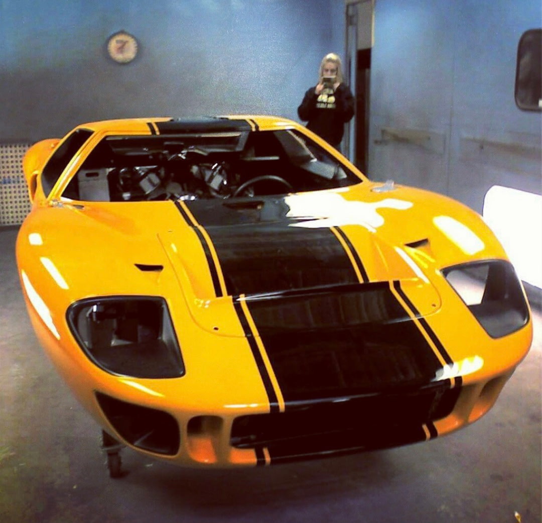 Paint technician working on a vehicle panel